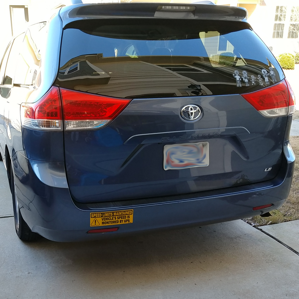 TOTOMO rear view of a blue Toyota with a GPS speed monitored sign