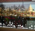 TOTOMO snow village window decals displayed across a storefront window