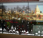 TOTOMO snow village window decals displayed across a storefront window