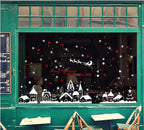 TOTOMO white village and sleigh decorations on a green storefront window