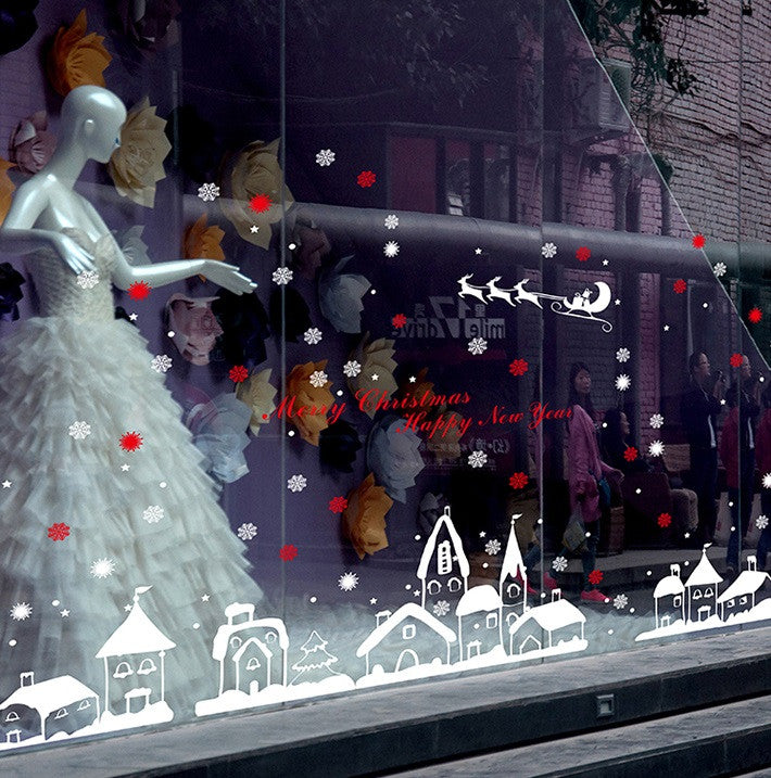 TOTOMO snow village and sleigh decals on a fashion display window