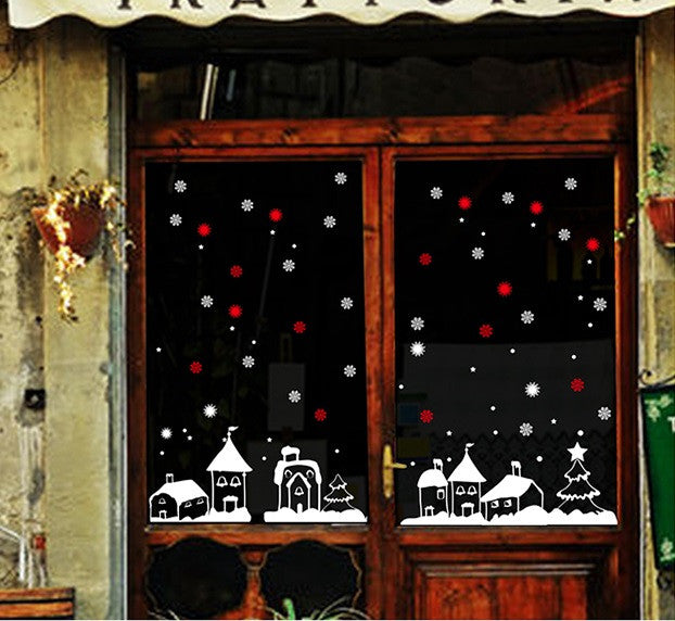 TOTOMO holiday village and snowflake window decorations beside a wooden door